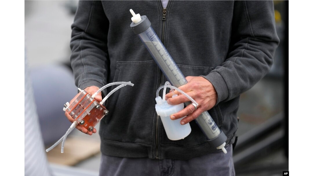 Dante Simonetti holds a small-scale model of technology called SeaChange on April 12, 2023, in San Pedro, Calif. (AP Photo/Ashley Landis)