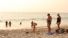 FILE - Russian tourists stay at the beach in Phuket, Thailand, March 12, 2022.