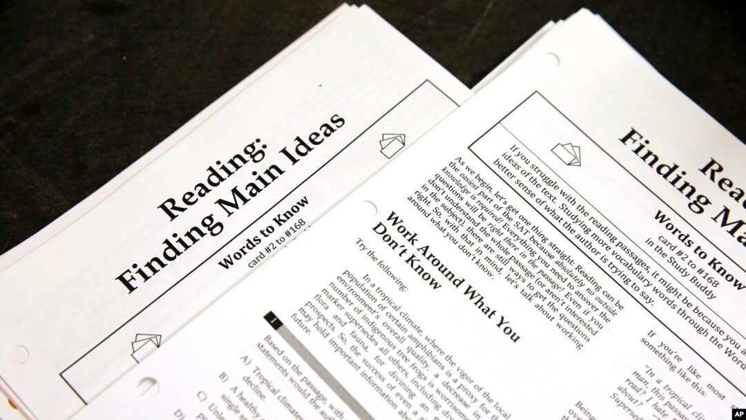 FILE - In this Jan. 17, 2016 file photo, students work sheets are seen at a college test preparation class at Holton Arms School in Bethesda, Md. (AP Photo/Alex Brandon, File)