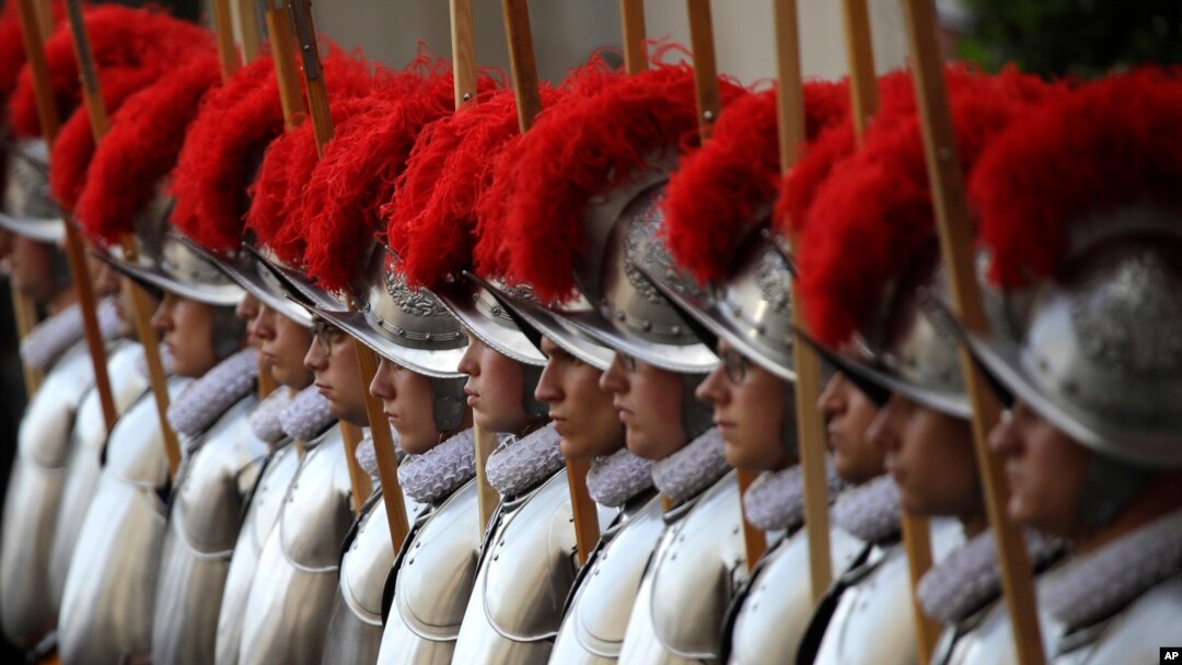 Swiss Guard recruits stands at attention during the swearing-in ceremony at the Vatican, Sunday, May 6, 2018.