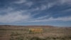 A sign promoting social distancing sits near the Navajo Nation town of Chinle, May 22,2020.