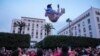 Moroccans celebrate in Rabat, Morocco, Saturday Dec. 10, 2022 their team's victory over Portugal in the World Cup quarter final soccer match played in Qatar. (AP Photo/Mosa'ab Elshamy)