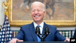 FILE - President Joe Biden smiles while speaking in the Roosevelt Room at the White House, April 28, 2022, in Washington. The White House Correspondents’ Association dinner returns Saturday night after a hiatus due to the COVID pandemic.