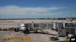 FILE - A plane stands parked at the Chinese-funded Siem Reap-Angkor International Airport, in Cambodia as it opened on Nov. 16, 2023.