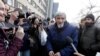 FILE - Russian historian Yuri Dmitriyev, center, speaks to the media outside a court in the city of Petrozavodsk, northwestern Russia, April 5, 2018.