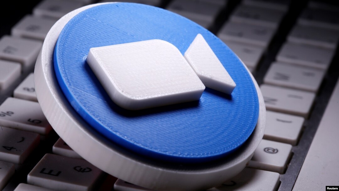 A 3D printed Zoom logo is placed on the keyboard in this illustration taken April 12, 2020. (REUTERS/Dado Ruvic/Illustration)