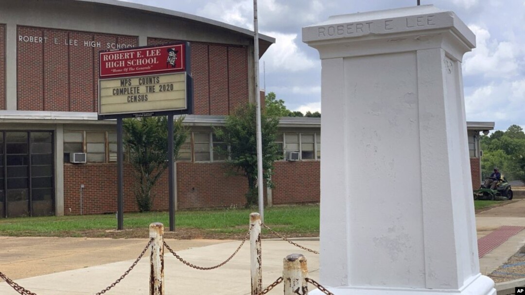 A pedestal that held a statue of Robert E. Lee stands empty outside a high school named for the Confederate general in Montgomery, Ala. on Tuesday, June 2, 2020. (AP Photo/Kim Chandler)