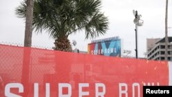 Super Bowl LV signage surrounds Raymond James Stadium ahead of the weekend's Super Bowl LV between the Kansas City Chiefs and Tampa Bay Buccaneers in Tampa, Fla., Feb. 6, 2021. 