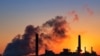 FILE - A coal-fired power plant is silhouetted against the morning sun in Glenrock, Wyoming, July 27, 2018.