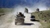 FILE - U.S. forces and Afghan commando patrol in the Achin district of Jalalabad, east of Kabul, Afghanistan, April 2014.
