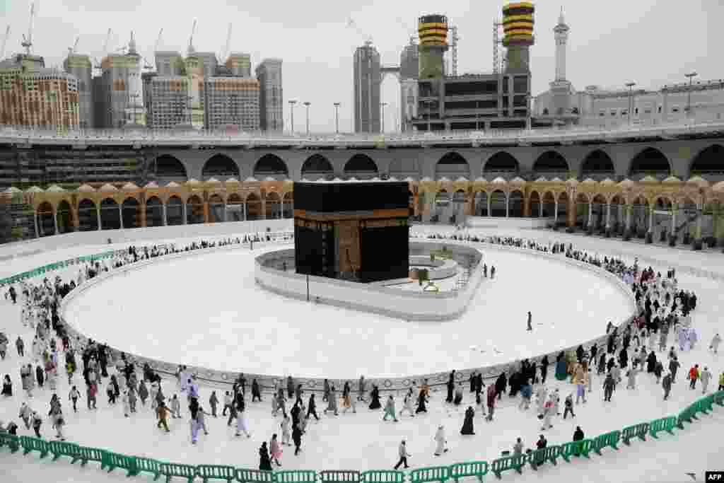 Muslim worshippers circumambulate the sacred Kaaba in Mecca's Grand Mosque, Islam's holiest site, in Saudi Arabia.