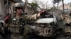 U.S. soldier at site of suicide bombing at police compound in Surobi district of Kabul, Feb. 21, 2014.