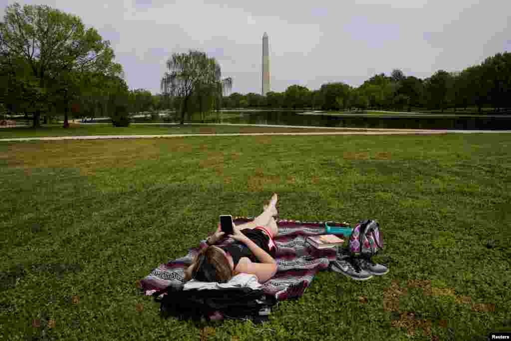 Chelsea Bruchs enjoys a nice day on the National Mall during the COVID-19 pandemic continues in Washington, D.C., April 29, 2020.