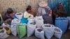 ARCHIVO: Vendedoras de patatas secas en un mercado de El Alto, en Bolivia, en 2013.