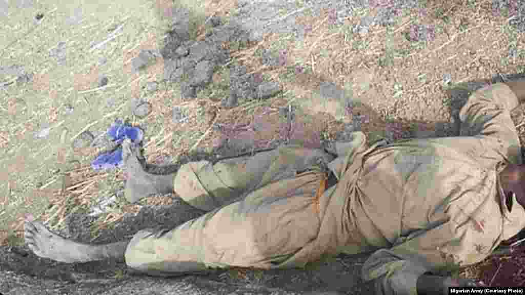 A Boko Haram fighter lies dead after an attack on Dikwa, Borno State, Nigeria, February 24, 2016.