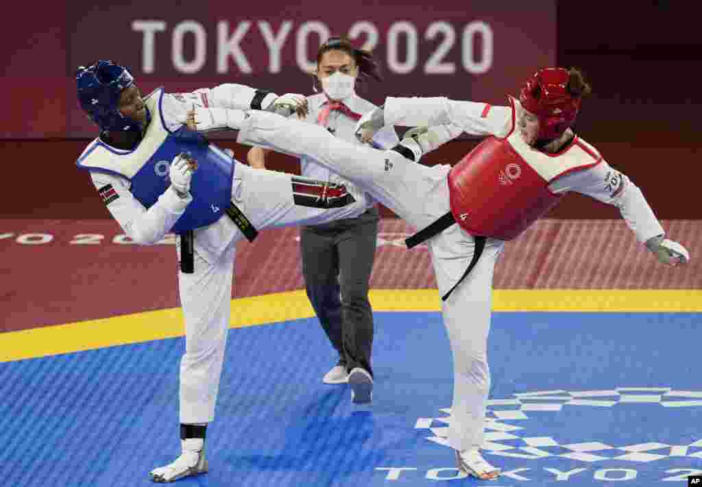 Kenya's Faith Ogallo, left, competes with Poland's Aleksandra Kowalczuk during the taekwondo women's 67kg match at the 2020 Summer Olympics, Tuesday, July 27, 2021, in Tokyo, Japan. (AP Photo/Themba Hadebe)