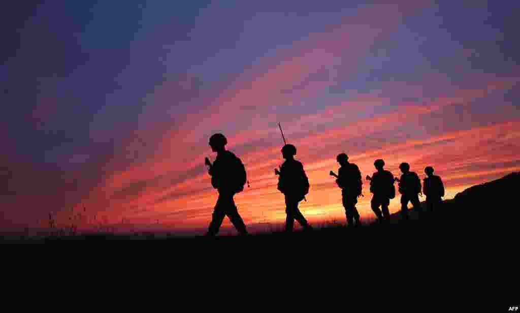 South Korean marines patrol during sunset on the South Korea-controlled island of Yeonpyeong near the &#39;northern limit line&#39; sea boundary with North Korea.