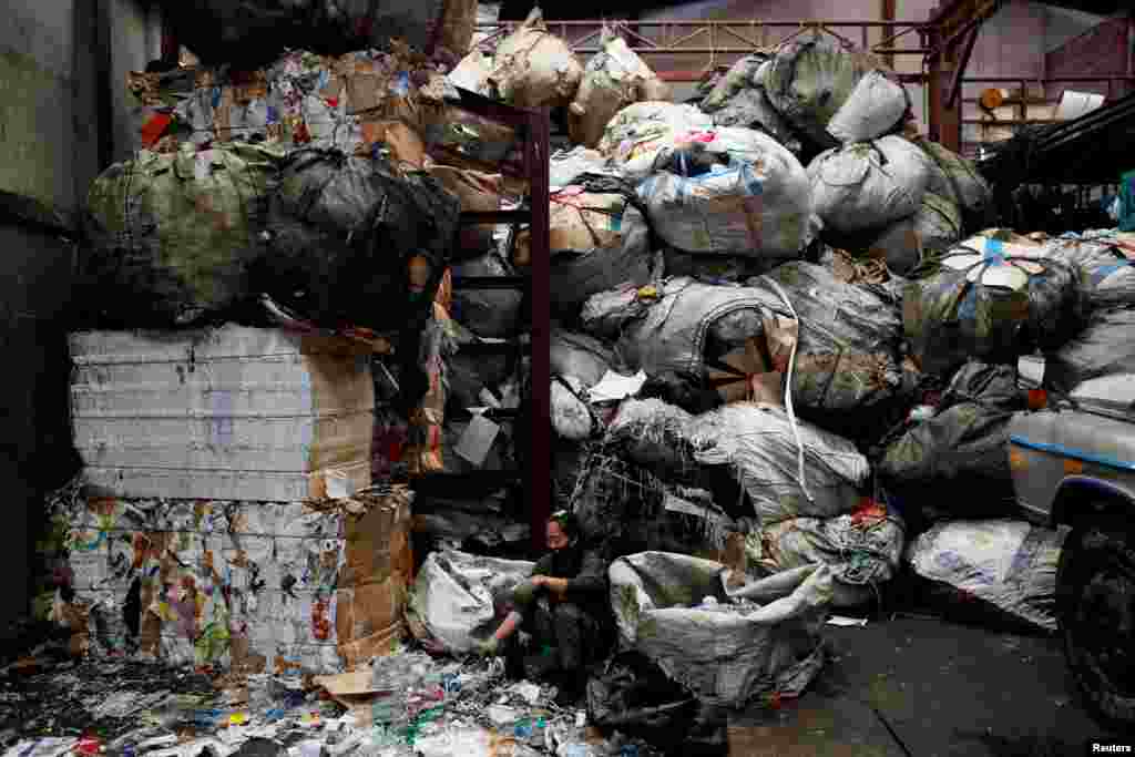 A woman works in a recycling plant in Bangkok, Thailand.