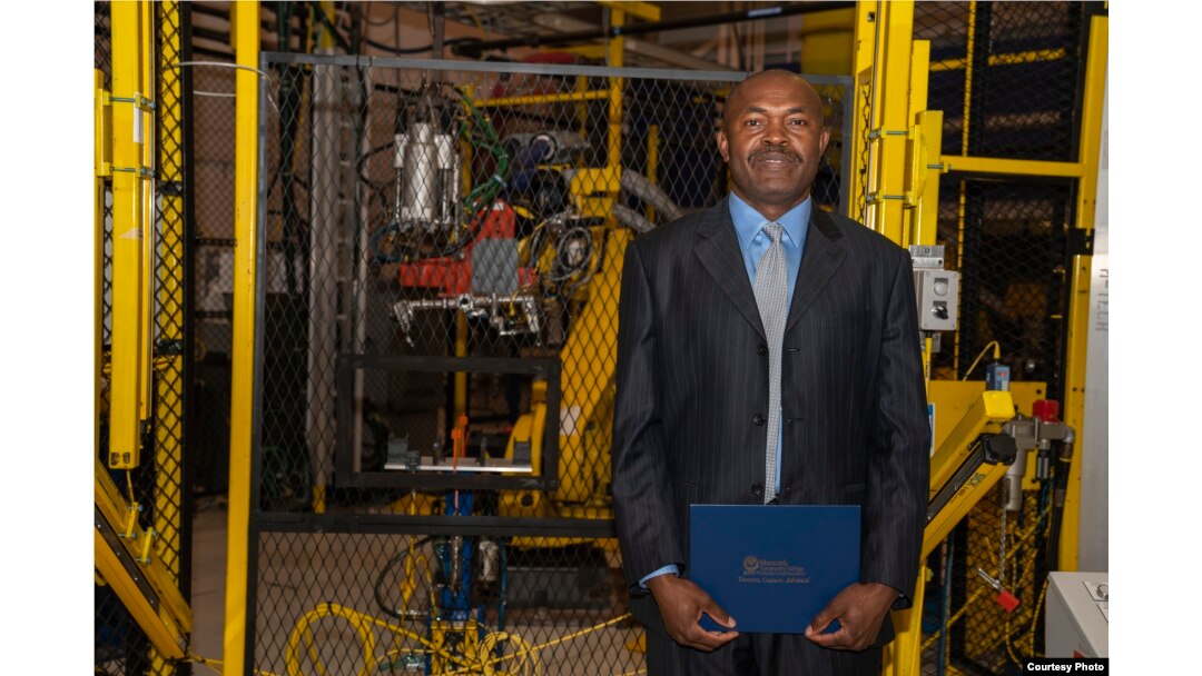 Julius Wakam with his Controls Technician certificate at the Aug. 8, 2018, graduation ceremony at Macomb Community College’s M-TEC facility in Warren, Michigan.