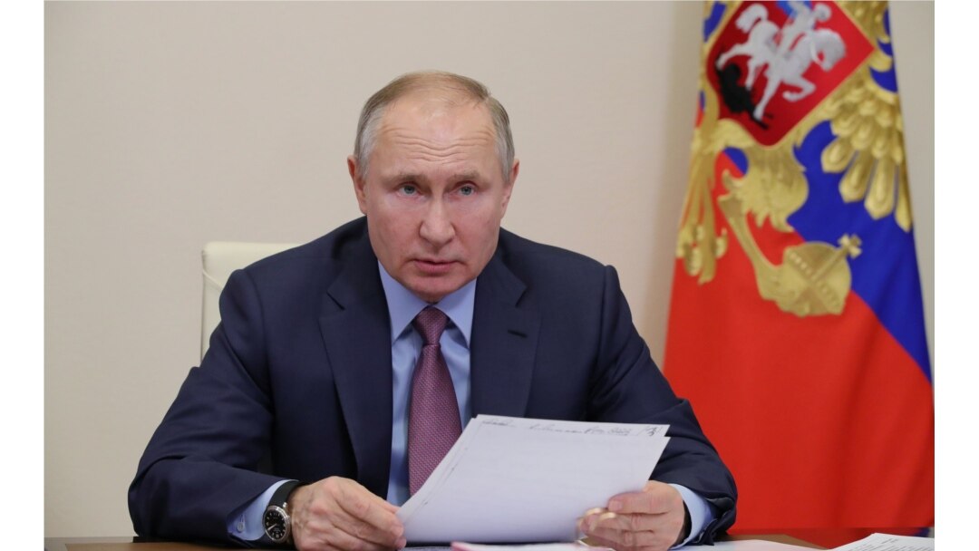FILE - Russian President Vladimir Putin chairs a video-conference meeting at Novo-Ogaryovo state residence outside Moscow, Russia, Feb. 10, 2021.