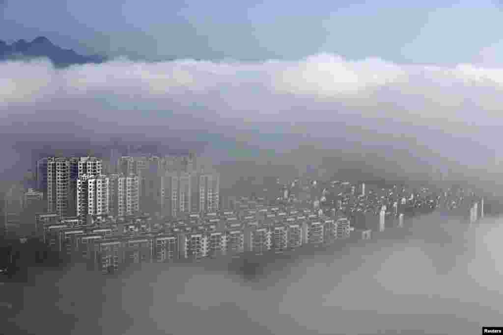 Residential buildings are seen after rain in Huangshan, Anhui province, China.