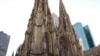 Charity workers dressed as Santa Claus pass St. Patrick's Cathedral in New York City in an annual parade to raise money for a holiday food program for needy residents