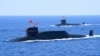 资料照：中国海军094A晋级弹道导弹战略核潜艇在南中国海参加军事表演。（2018年4月12日）