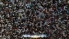 Crowds throng a religious festival in Nakhon Pathom province, Thailand, on March 23, 2024. Thailand's low birth rate could mean the population will shrink by half within 60 years.