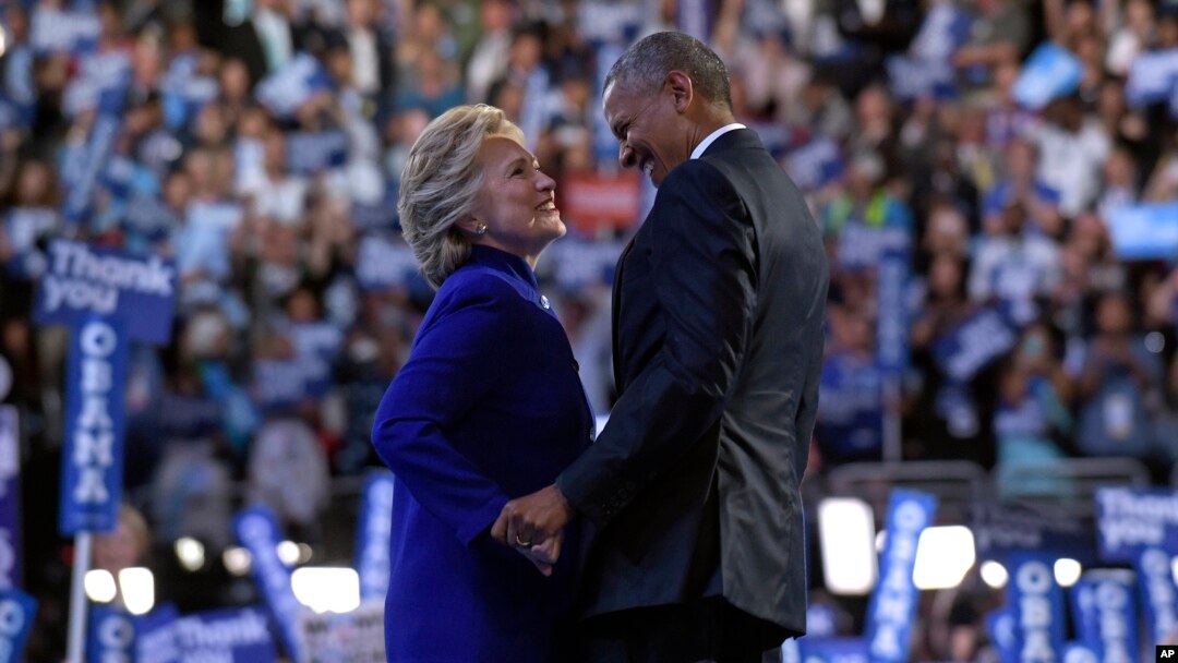 President Barack Obama, right, talks with Democratic presidential candidate Hillary Clinton, left, following Obama's speech at the Democratic National Convention in Philadelphia, Wednesday, July 27, 2016. (AP Photo/Susan Walsh)